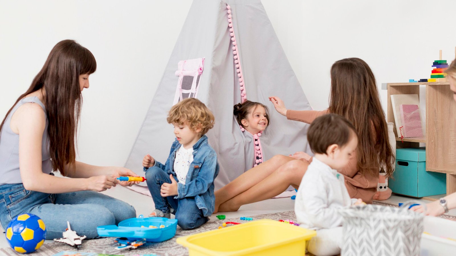 women-playing-home-with-children-toys